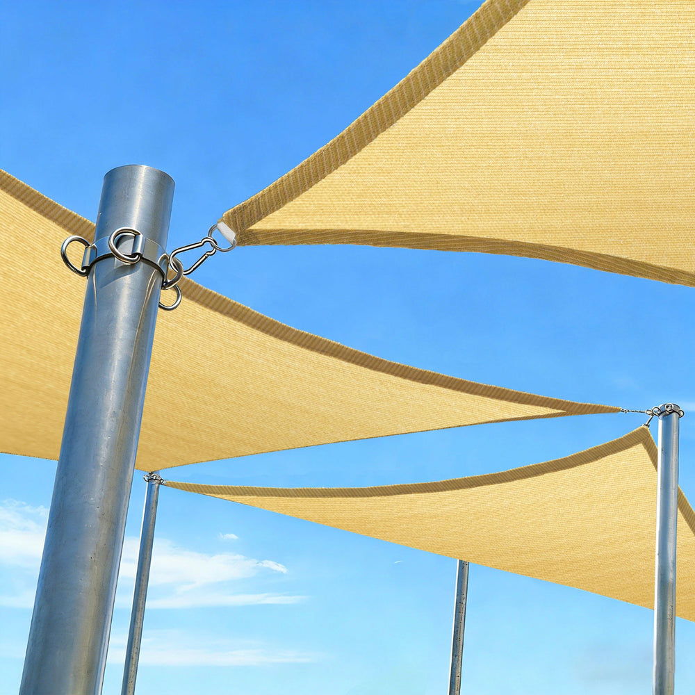 Beige sunshade sail attached to metal poles 丨Royal Shade