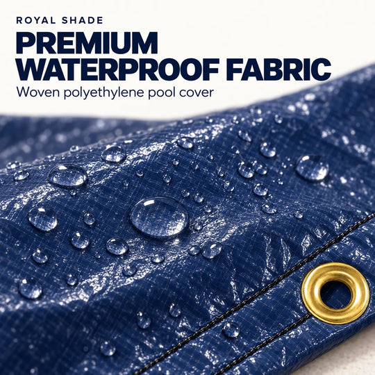 Close-up of a blue woven waterproof fabric with water droplets on the surface and a gold grommet, with text reading 'ROYAL SHADE PREMIUM WATERPROOF FABRIC' and 'Woven polyethylene pool cover'.