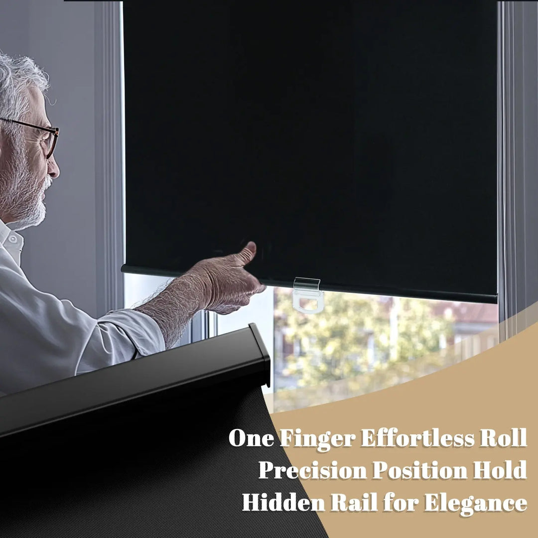 Person using hem handle on black roller shade with black bottom rail close-up inset