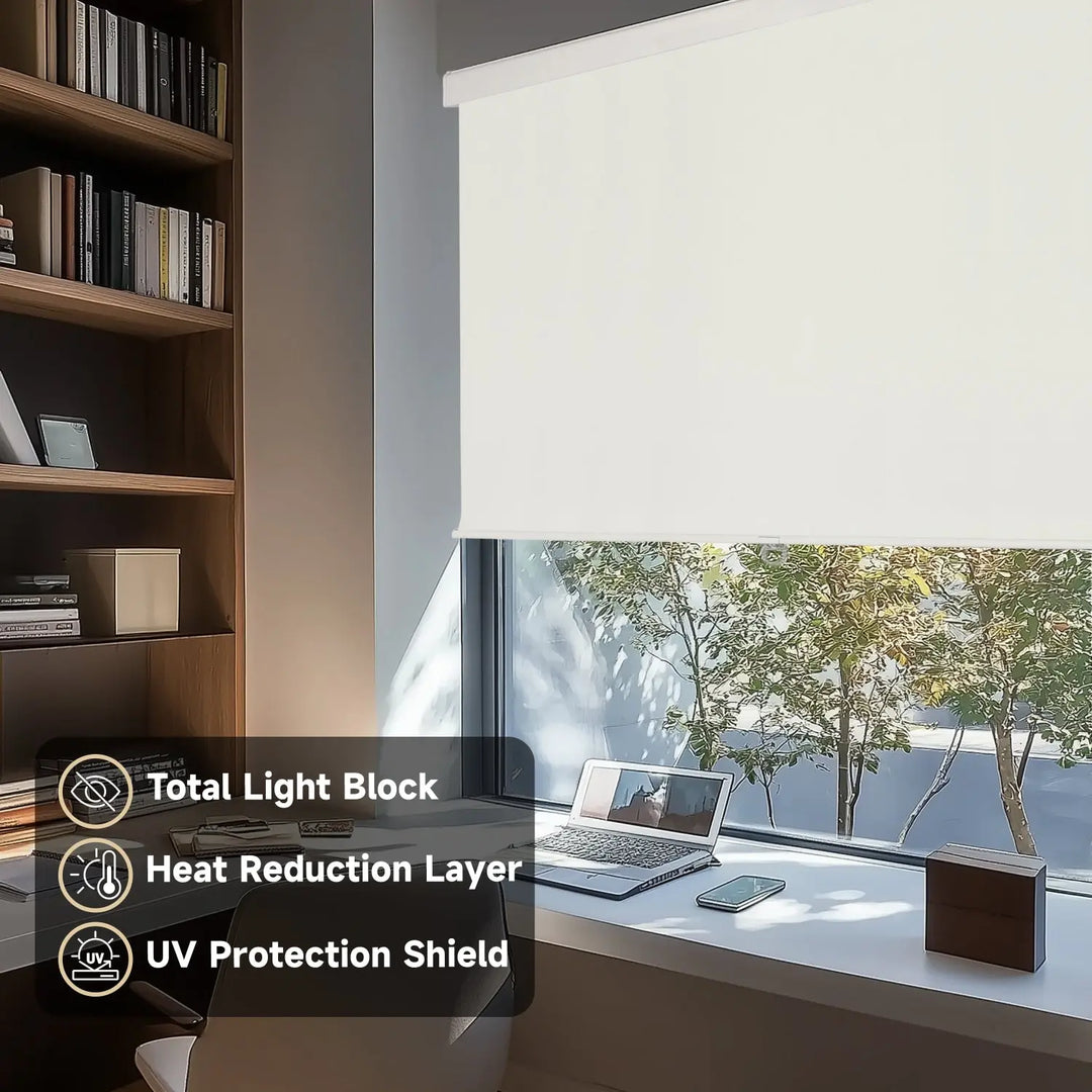 Light beige blackout roller shade on home-office window beside laptop and bookcase with light-control labels