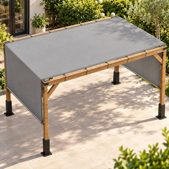 Gray Royal Shade pergola cover with stainless steel rods installed over a wooden four-post pergola, showing short-end hanging panels and gold-tone grommets on long edges.