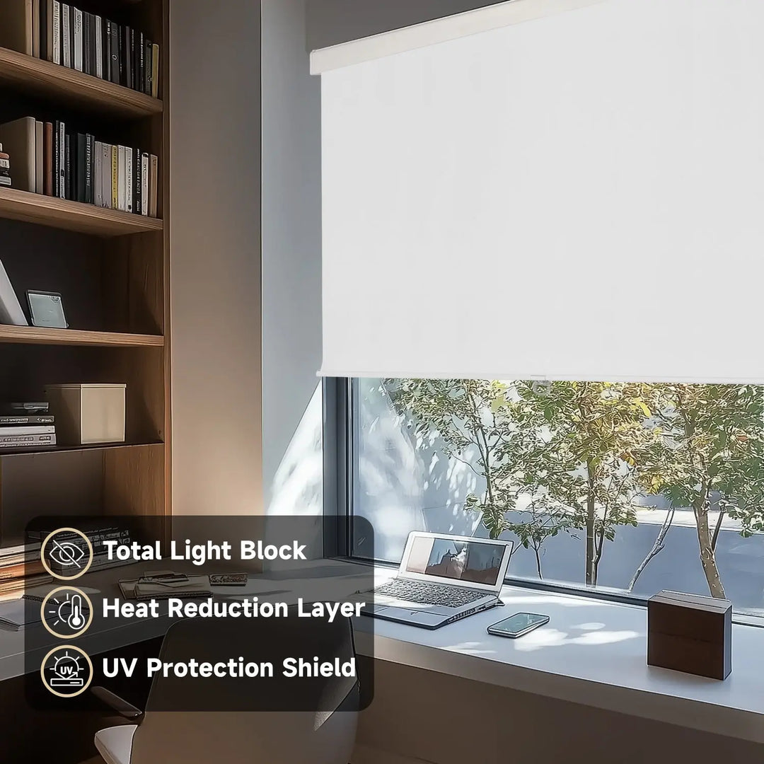 White blackout roller shade on home-office window beside laptop and bookcase with light-control labels